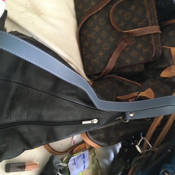 a Cleo $ Palek  asymmetrical leather backpack
